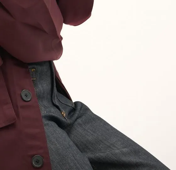 Wide-leg denim, dark raw: dark raw denim with contrast stitching, worn under the cherry trench